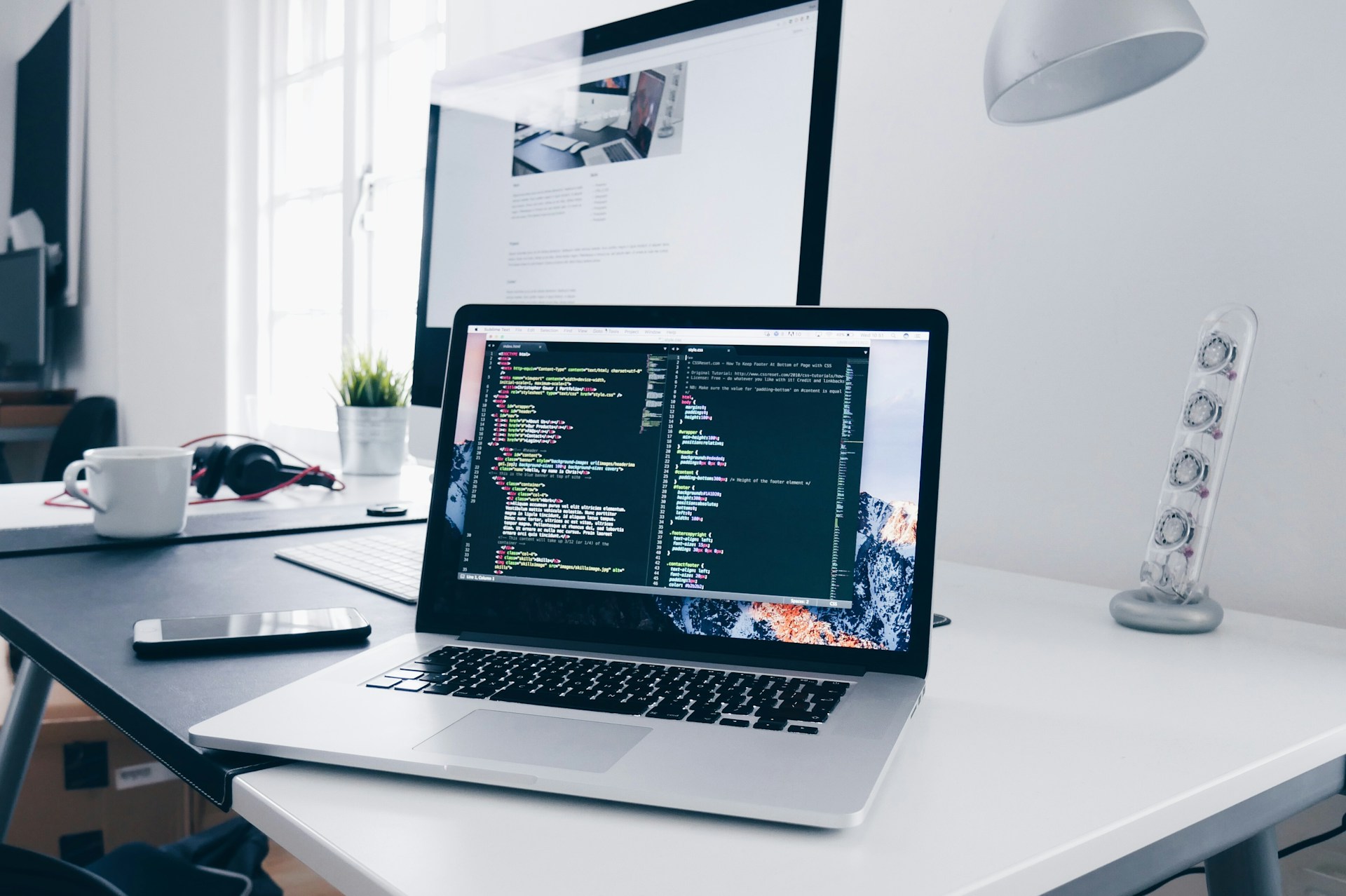A developer working on a laptop in a modern workspace, symbolizing the solo builder economy in the AI era