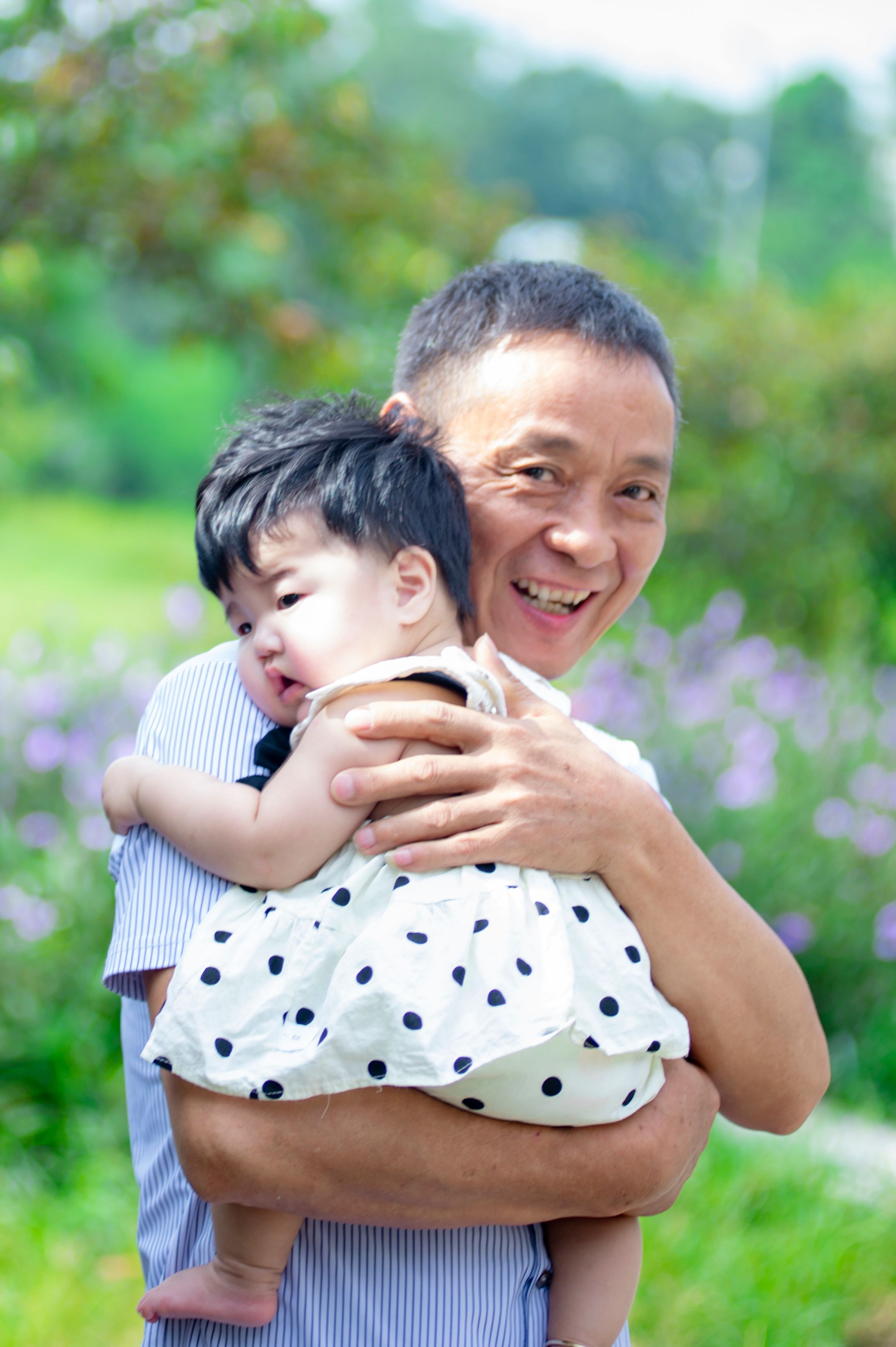 Father and daughter enjoying a warm sunny day outdoors, representing hope for healing the Chinese father-daughter bond