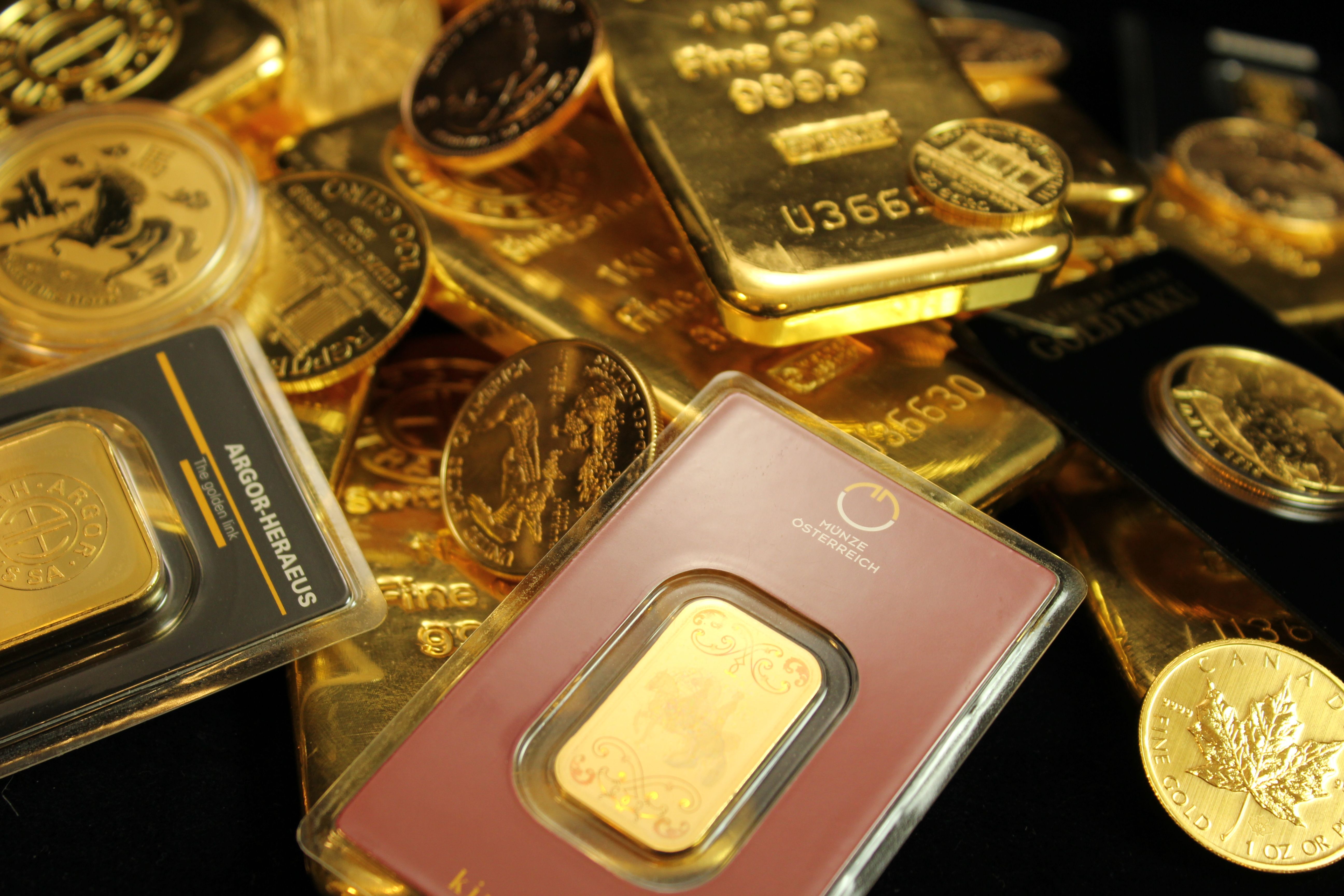 Detailed close-up of gold bars and coins symbolizing wealth and investment opportunities
